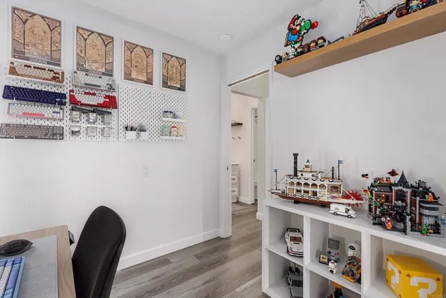 a room with cabinets and wooden floor
