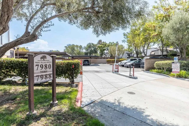 a sign board with parking space