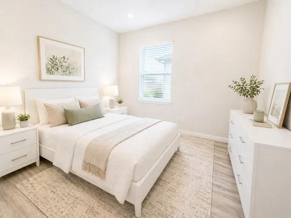 a bedroom with bed and window