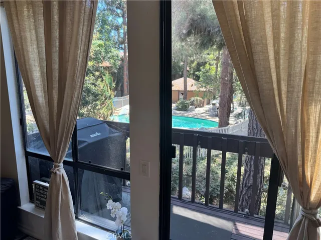 a view of a balcony with wooden floor