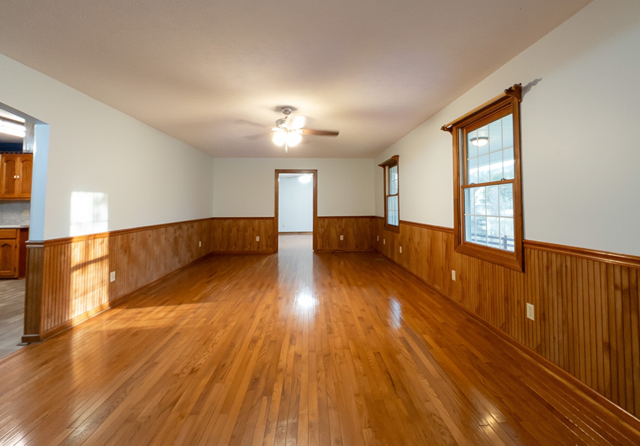 6680 Walker Creek Road Alexandria, TN 37012 - Photo 22 of 76 a view of an empty room with wooden floor and a window