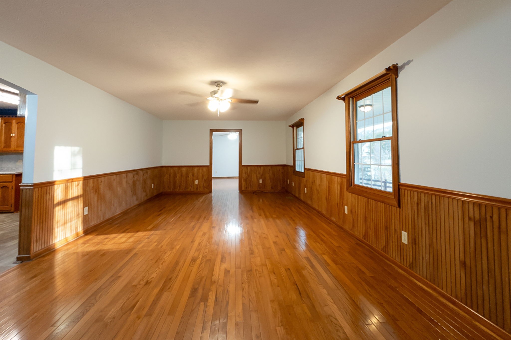 6680 Walker Creek Road Alexandria, TN 37012 - Photo 26 of 75 a view of an empty room with wooden floor and a window
