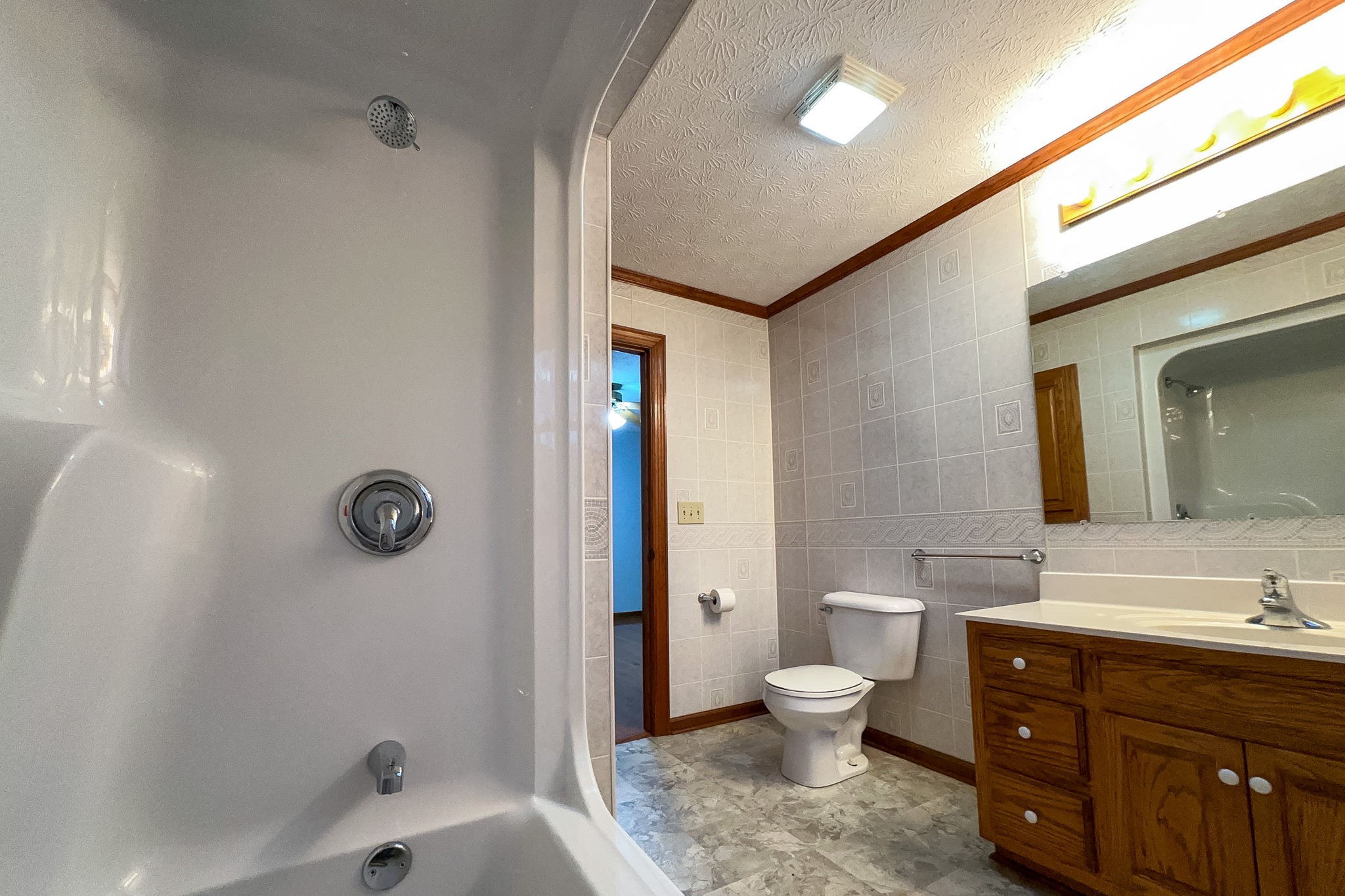 6680 Walker Creek Road Alexandria, TN 37012 - Photo 34 of 75 a bathroom with a toilet a sink and a mirror