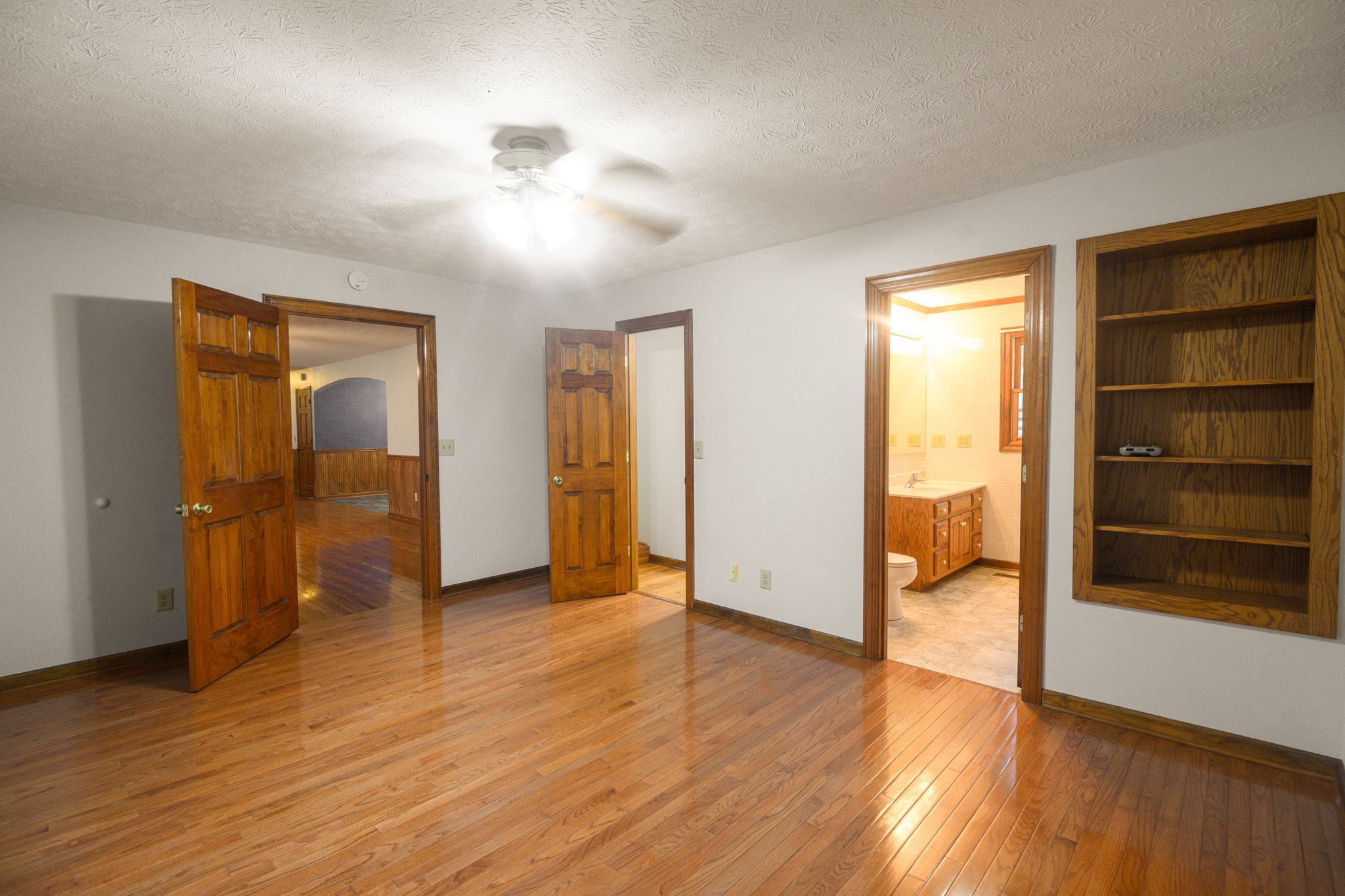 6680 Walker Creek Road Alexandria, TN 37012 - Photo 35 of 76 a view of an empty room with wooden floor and a window