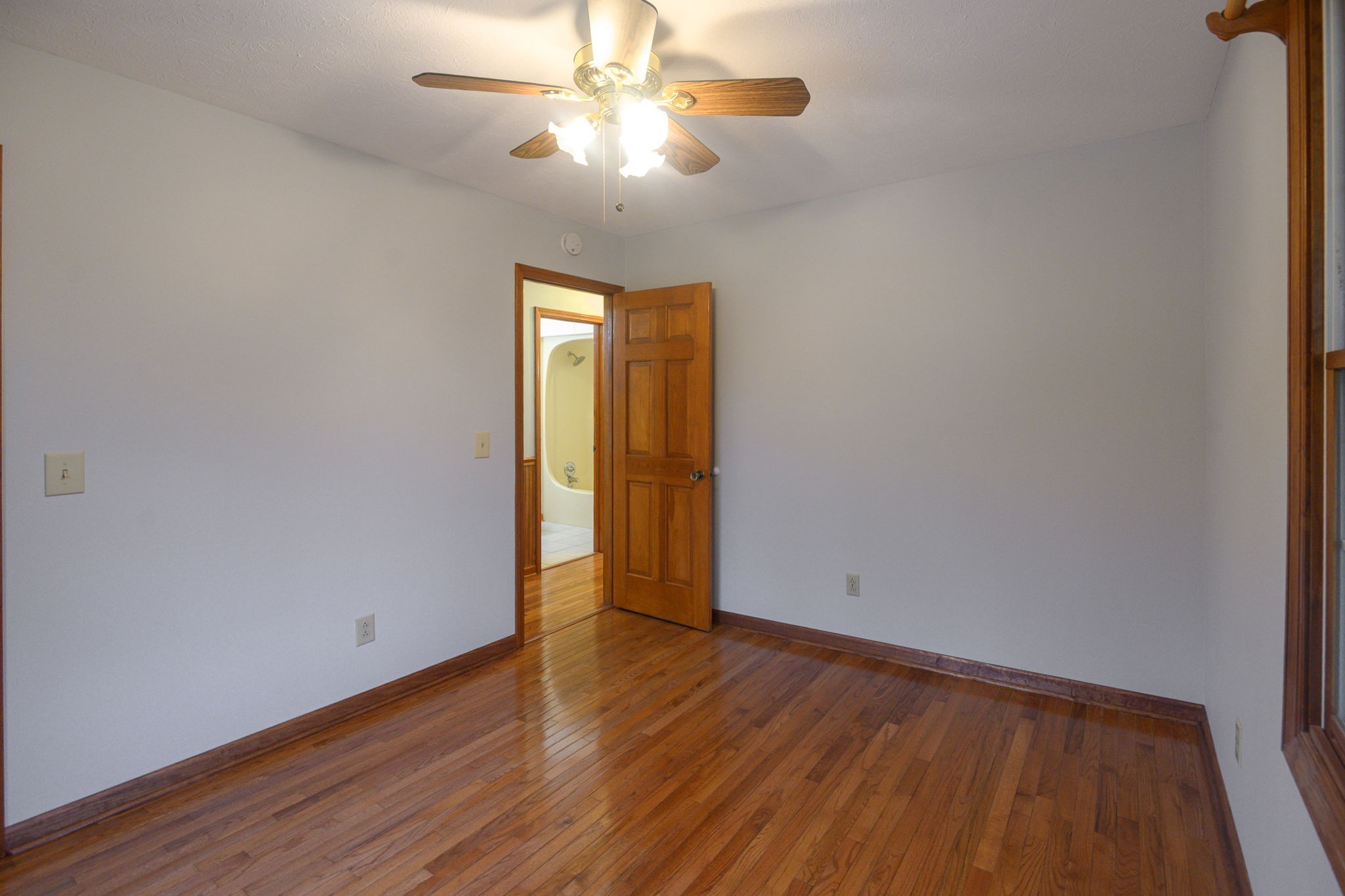 6680 Walker Creek Road Alexandria, TN 37012 - Photo 44 of 76 a view of an empty room with wooden floor