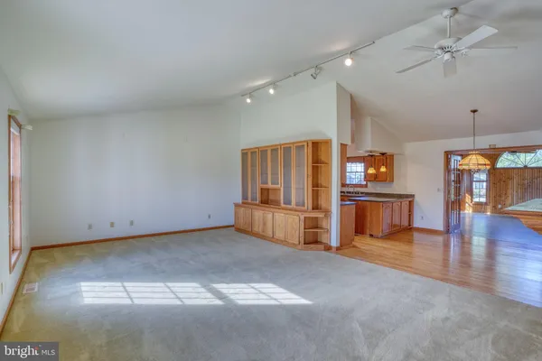 a view of kitchen with furniture and wooden floor