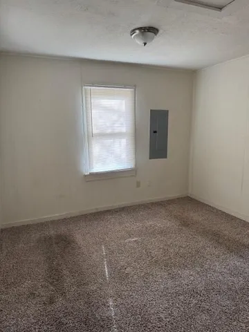 a white stove top oven sitting inside of a kitchen