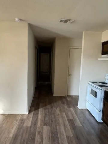 a white toilet sitting next to a bath tub