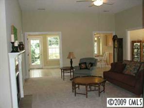 500 Crabtree Court Fort Mill, SC 29708 - Photo 2 of 8 a living room with furniture a large window and a fireplace