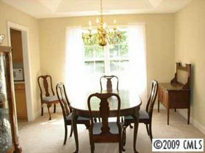 500 Crabtree Court Fort Mill, SC 29708 - Photo 4 of 8 a view of a dining room with furniture and chandelier