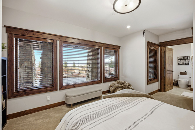 7885 North Rabbitbrush Court, Unit 13 Park City, UT 84098 - Photo 50 of 88 Well-appointed room featuring three windows with wood-finish blinds, light beige carpeting, recessed lighting, and a contemporary ceiling fixture