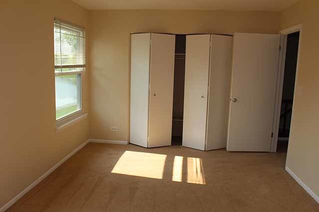779 Pahl Road, Unit 779 Elk Grove Village, IL 60007 - Photo 11 of 17 a view of an empty room with a window