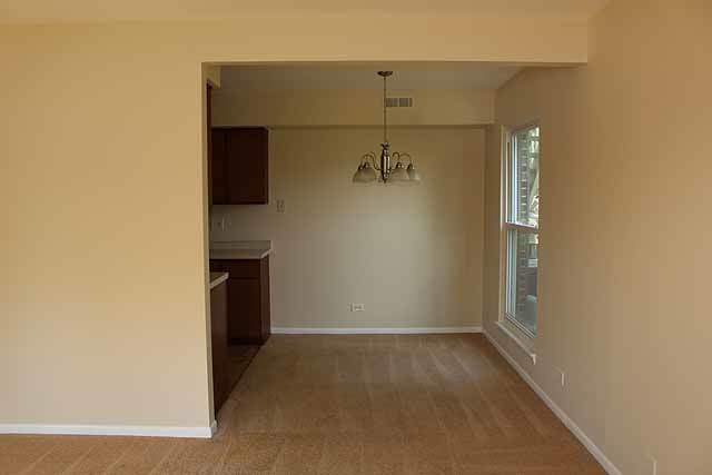 779 Pahl Road, Unit 779 Elk Grove Village, IL 60007 - Photo 4 of 17 an empty room with a empty space