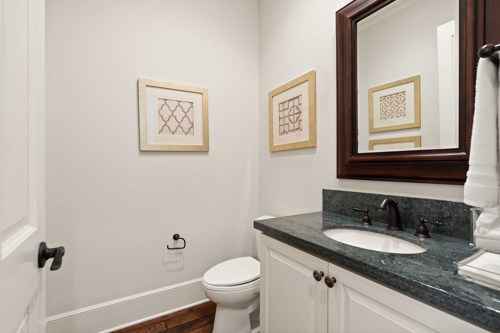 11402 Taylorcrest Road Houston, TX 77024 - Photo 36 of 44 Conveniently located downstairs & easily accessible from the kitchen, this secondary powder bath features a vanity w/ granite countertop. A practical addition thoughtfully positioned for guests & everyday functionality. One of two powder baths on the first floor.