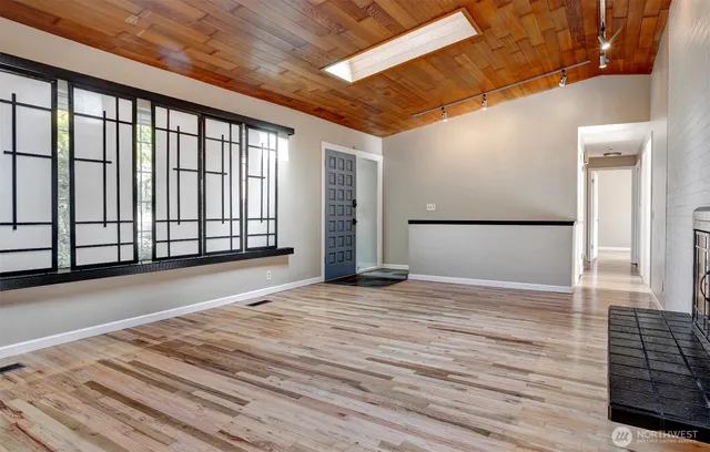 a view of an empty room with a window