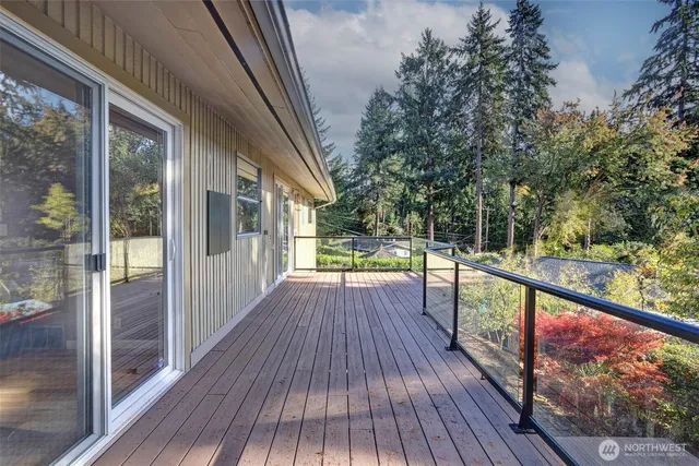 a view of balcony with wooden floor