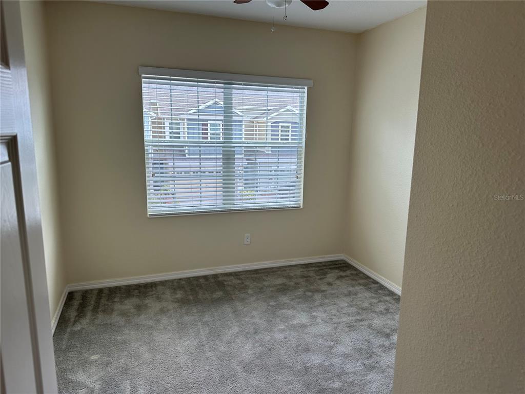 4851 Cliveden Loop Sanford, FL 32773 - Photo 14 of 24 a view of an empty room with a window