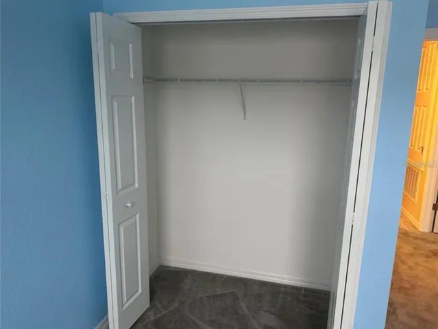 a view of an empty room with a bathroom