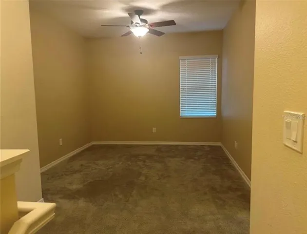 a white toilet sitting next to a bath tub