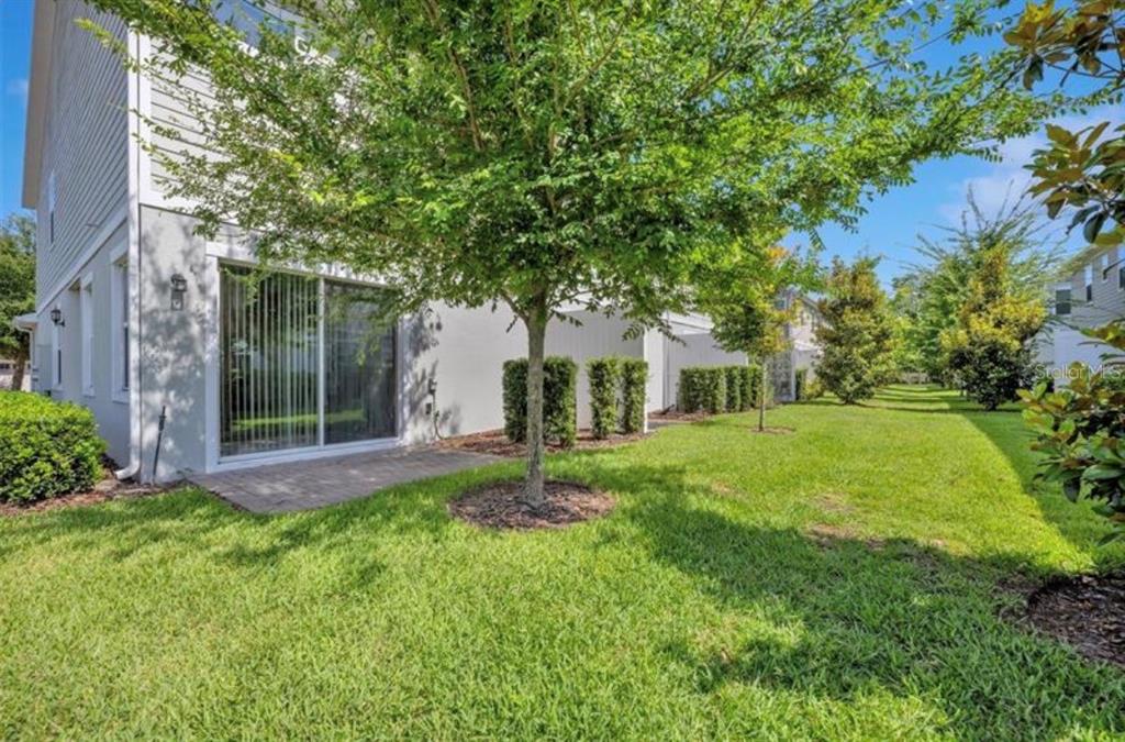 4851 Cliveden Loop Sanford, FL 32773 - Photo 20 of 24 a view of a house with a big yard plants and large trees