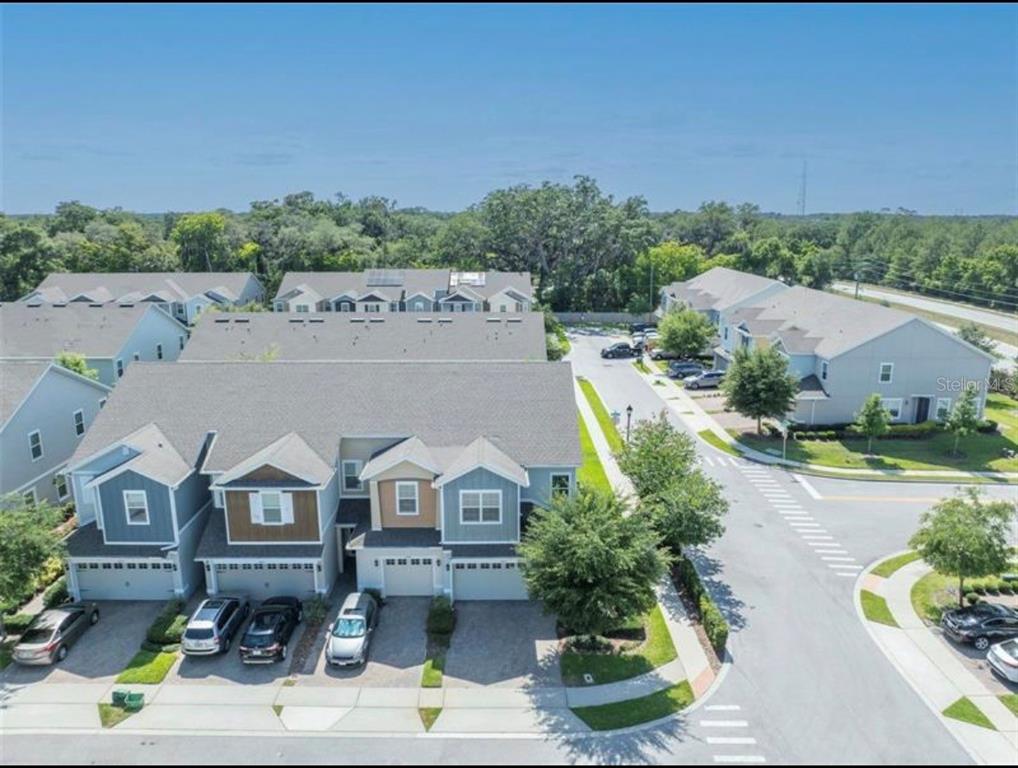 4851 Cliveden Loop Sanford, FL 32773 - Photo 21 of 24 an aerial view of a house with a garden