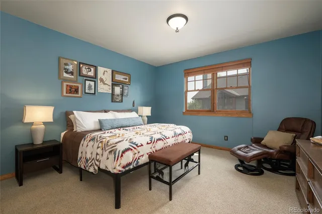 a bedroom with a bed and a night stand