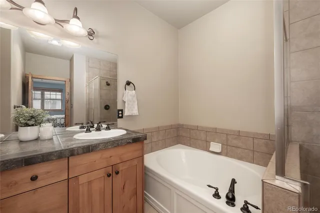 a view of a hallway with dining room and furniture