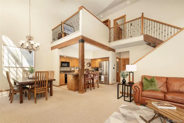 a kitchen with a sink cabinets and wooden floor