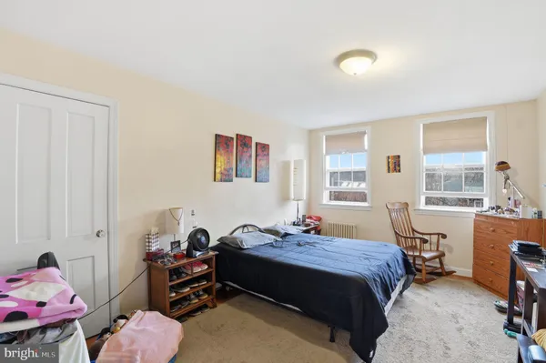 a bed room with a bed and a window