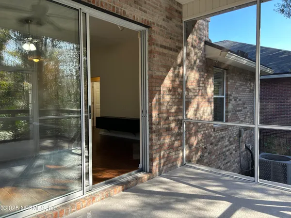 a view of a glass door of the house