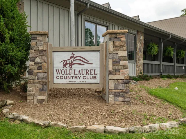 a sign broad on the side of a brick building