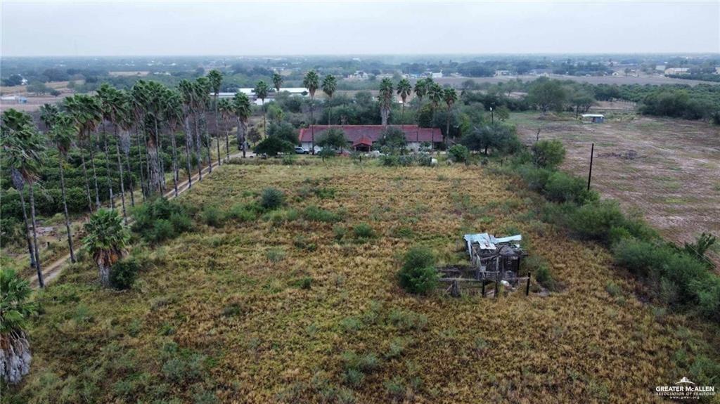 5906 North Brushline Road Mission, TX 78574 - Photo 12 of 29 a view of a fire pit with large trees