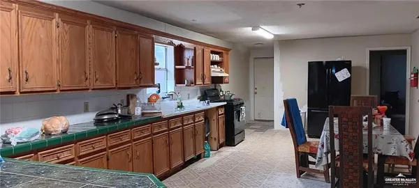 view of a bathroom with a glass door shower and sink