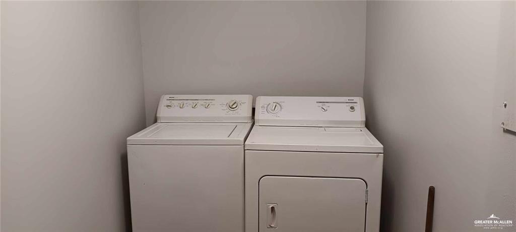 5906 North Brushline Road Mission, TX 78574 - Photo 22 of 29 a utility room with dryer and washer