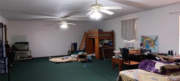 a room with a sink and a mirror