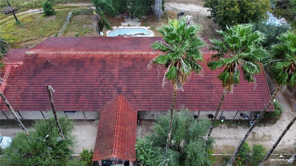 5906 North Brushline Road Mission, TX 78574 - Photo 4 of 29 a aerial view of a house with plants and large trees