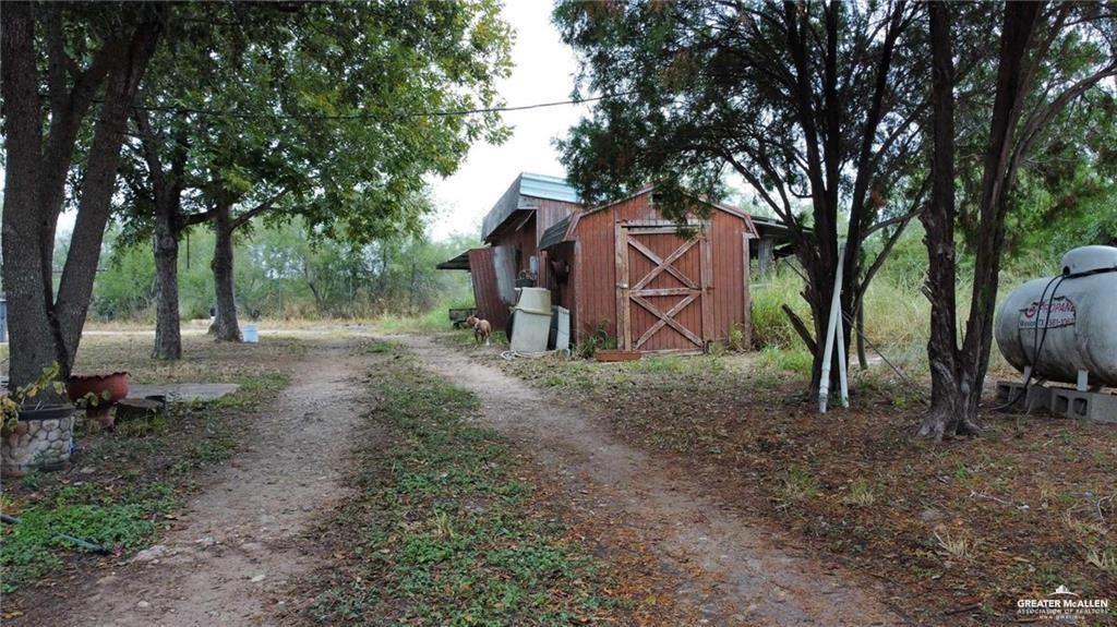 5906 North Brushline Road Mission, TX 78574 - Photo 6 of 29 a backyard of the house with lots of green space