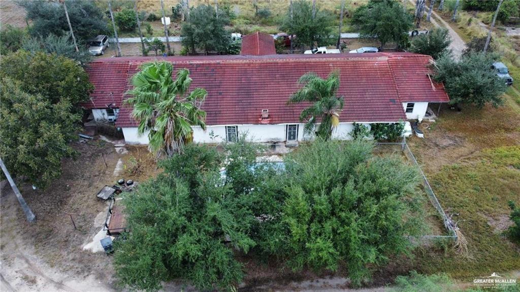 5906 North Brushline Road Mission, TX 78574 - Photo 8 of 29 an aerial view of a house with plants and large trees