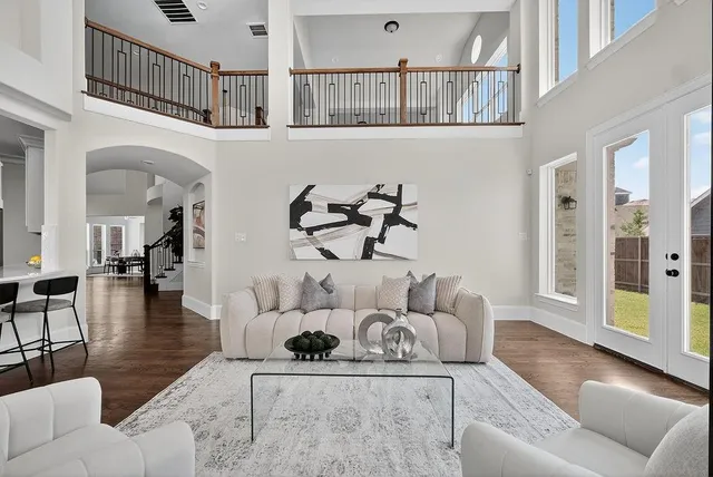 a living room with furniture and a rug