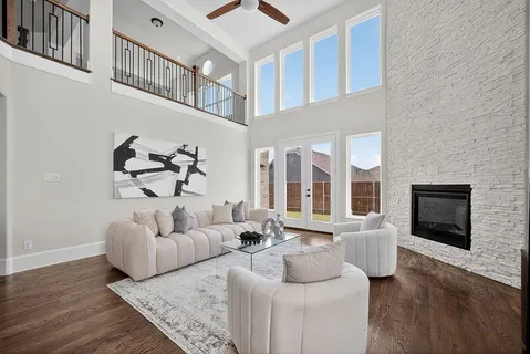 a living room with furniture fireplace and flat screen tv
