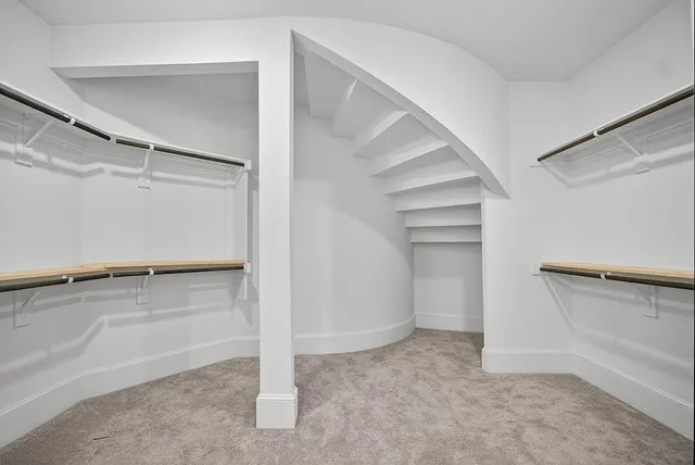 a view of an empty walk in closet