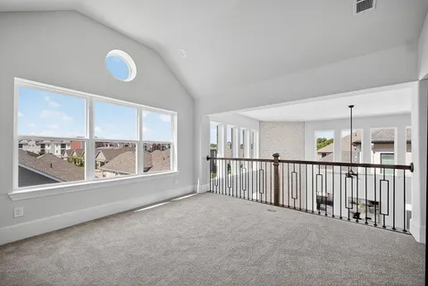 a view of an empty room and a window