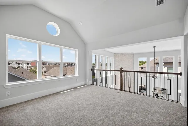 a view of an empty room and a window