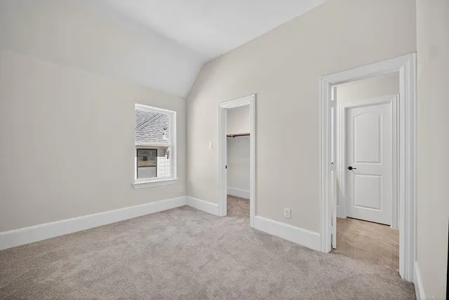 a brick building with a yard in front of it