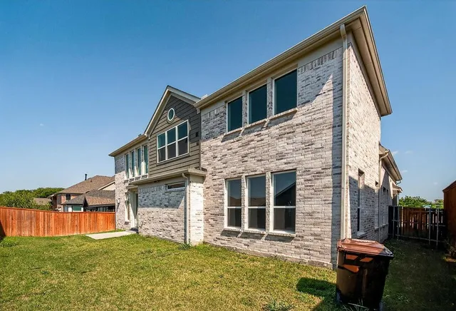 an aerial view of a house with outdoor space swimming pool