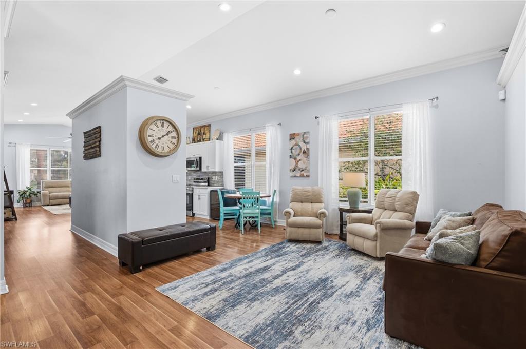 1770 Ribbon Fan Lane Naples, FL 34119 - Photo 11 of 37 a living room with furniture and a large window