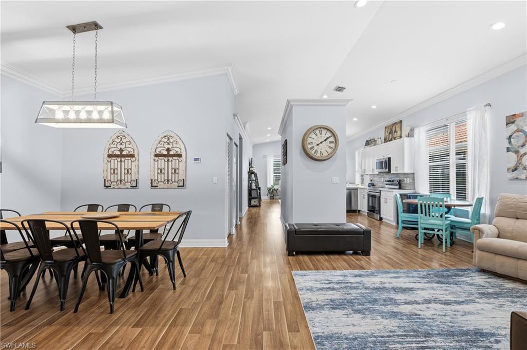 1770 Ribbon Fan Lane Naples, FL 34119 - Photo 12 of 37 a living room with furniture and wooden floor
