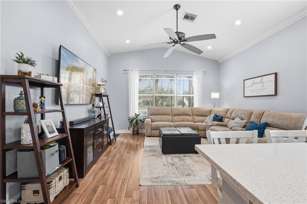 1770 Ribbon Fan Lane Naples, FL 34119 - Photo 15 of 37 a living room with furniture and a wooden floor