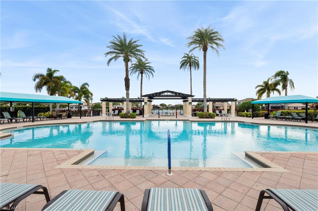1770 Ribbon Fan Lane Naples, FL 34119 - Photo 2 of 37 a view of a lake from a roof deck