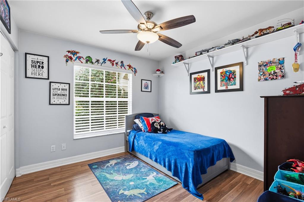1770 Ribbon Fan Lane Naples, FL 34119 - Photo 24 of 37 a bedroom with a bed and a window